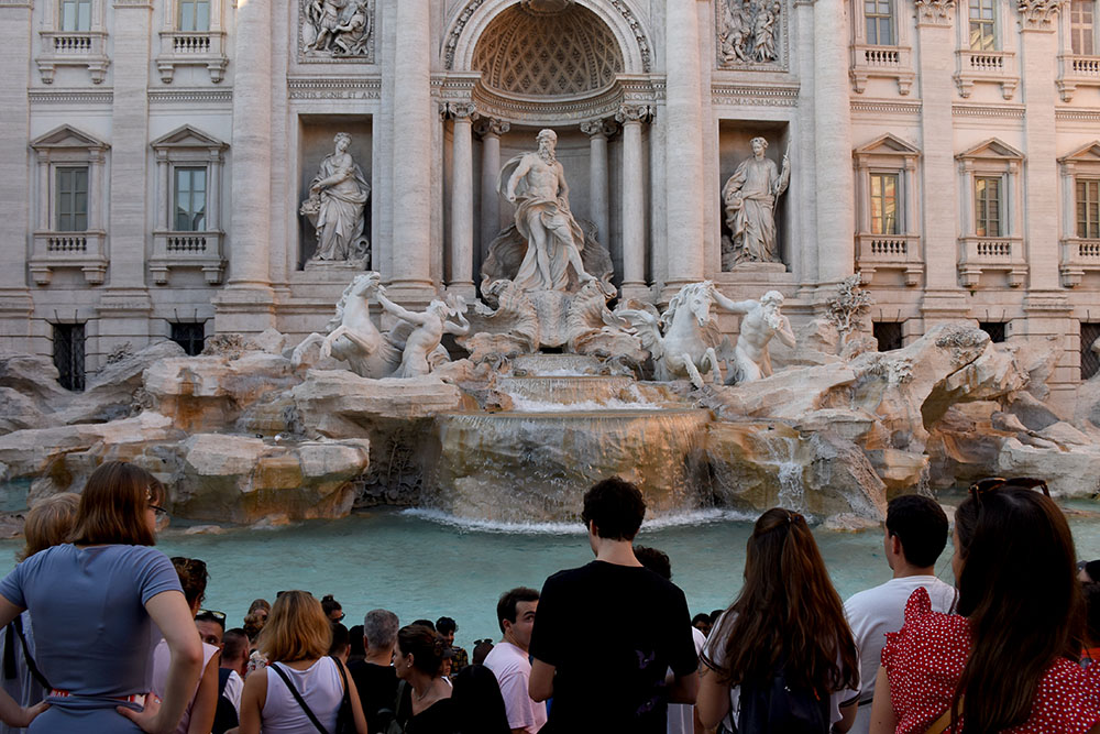 Crowd in front of the Trevi Fountain.