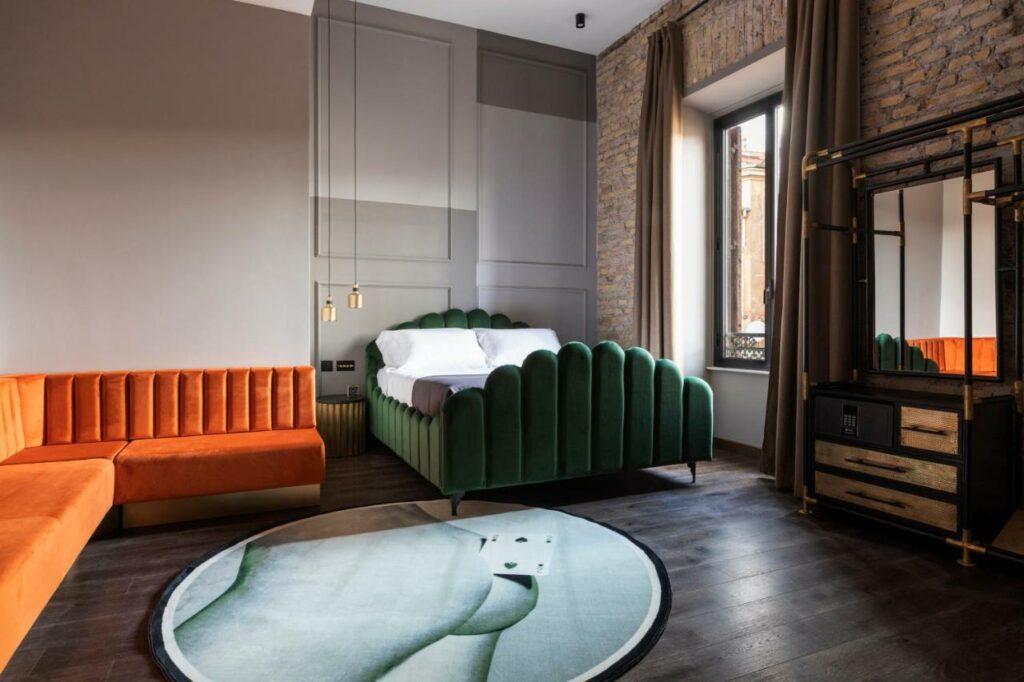 Mix of local and international designer furniture pieces in dark green and orange colors and bespoke finishes.
