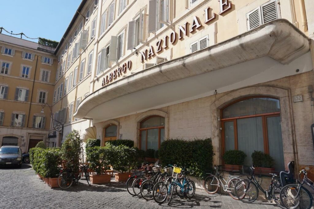 View of the Hotel Nazionale exterior with parked bicycles in front.